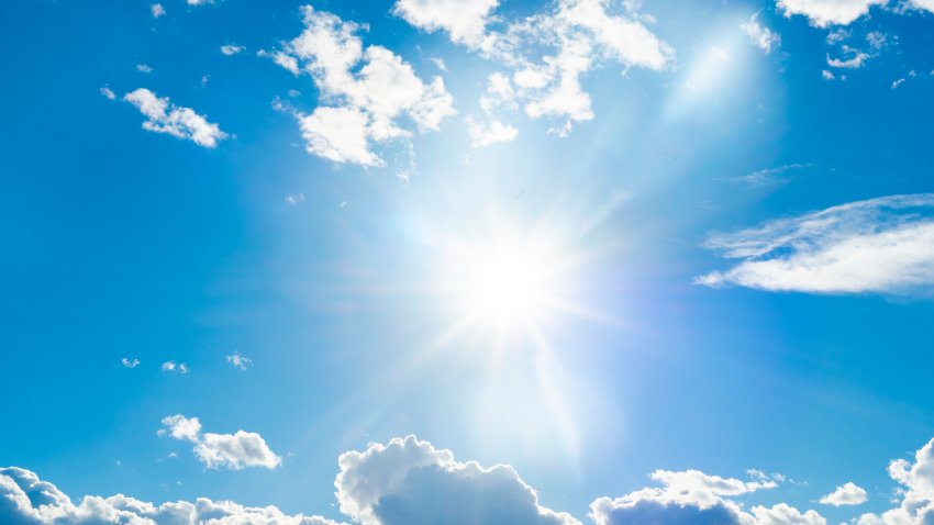 The sun shines brightly in the blue sky